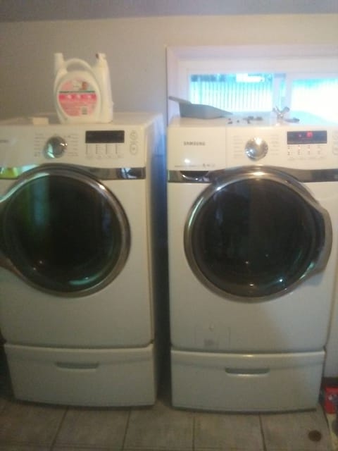 New washer and dryer. Full laundry room  with deep sink off kitchen. 