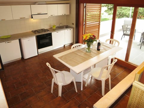 Furniture, Property, Table, Cabinetry, Window, Countertop, Plant, Sink, Wood, Lighting