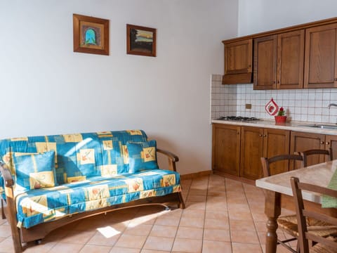 Property, Cabinetry, Furniture, Couch, Table, Lighting, Interior Design, Wood, Studio Couch, Countertop