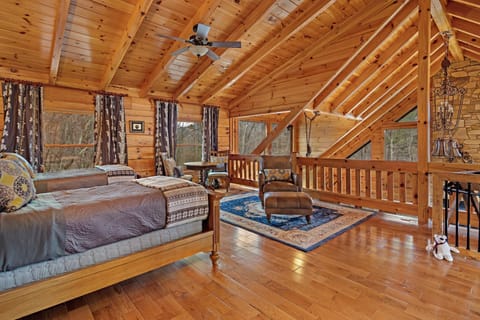 Upstairs loft with 2 twin beds and sitting area.