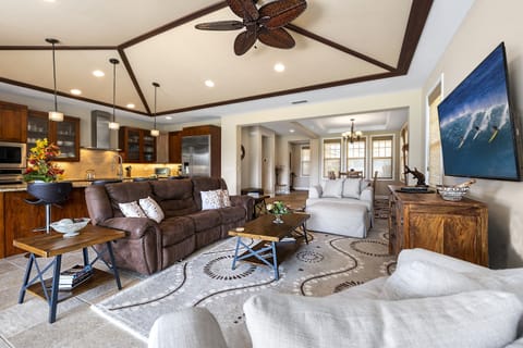 Cozy up in the stylish living room at Kona Blue Vacations Holua Kai, ideal for post-beach lounging.