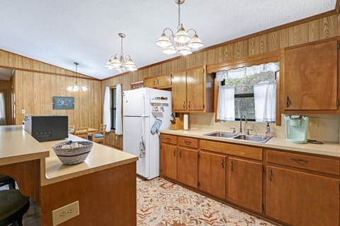 Kitchen has lots of available counter space for food preparation.