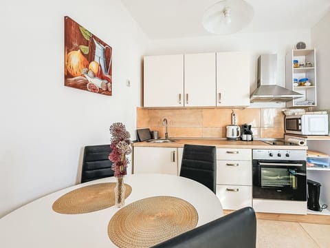 Furniture, Interior Design, Flooring, Floor, Wood, Room, Countertop, Kitchen, Ceiling, Chair