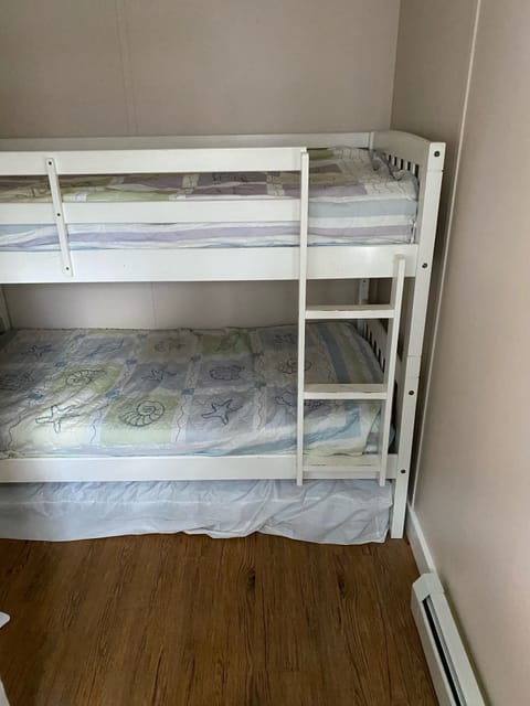 Downstairs bunk beds with extra bed under bottom bunk