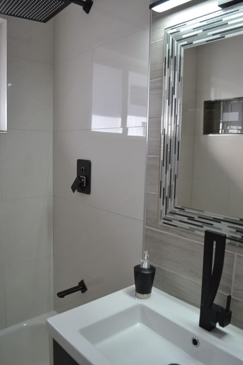 Shower, jetted tub, hair dryer, towels