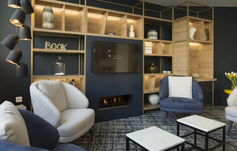 Warm up in front of the fireplace in the communal lounge.