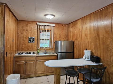 Full-size fridge, stovetop, coffee/tea maker, toaster