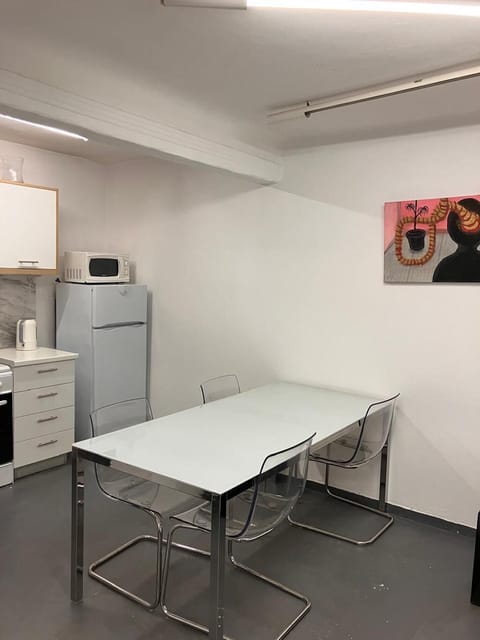 Dining area and kitchen in the background