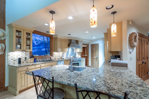 Breakfast bar seating by the kitchen.