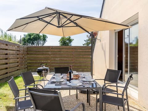 Furniture, Table, Property, Chair, Sky, Building, Outdoor Table, Shade, Outdoor Furniture, Wood