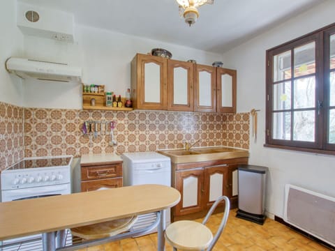 Furniture, Cabinetry, Property, Window, Countertop, Wood, Drawer, Interior Design, Lighting, Kitchen