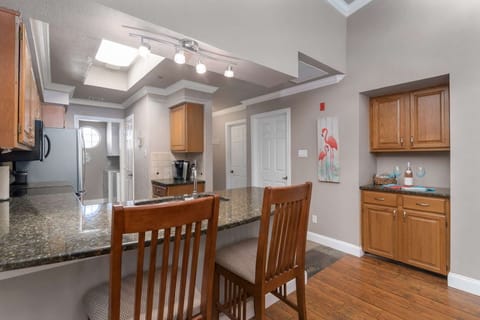 Open floor plan between kitchen and livingroom - barstool seating for afternoon snacks