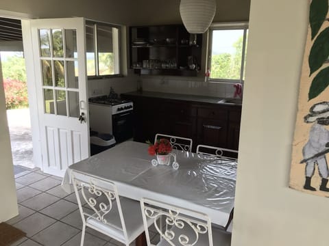Fridge, stovetop, electric kettle, dining tables