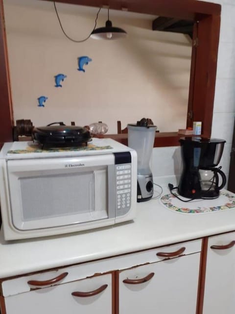 Fridge, microwave, coffee/tea maker, cookware/dishes/utensils