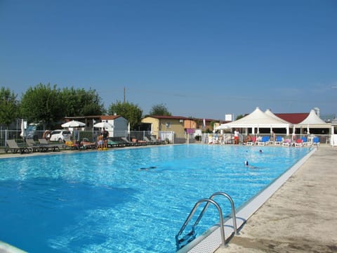 Water, Sky, Swimming Pool, Chair, Umbrella, Aqua, Leisure, Building, Outdoor Furniture, Resort Town