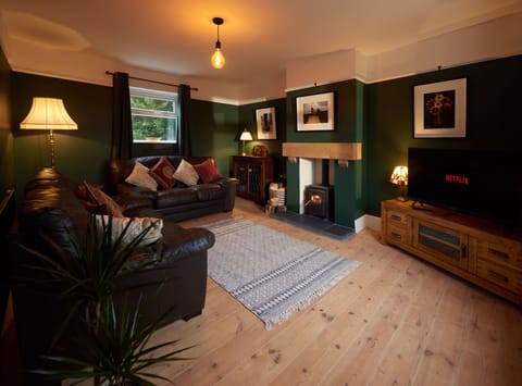 Cosy Living Room w/timber floors, logburner & Netflix.