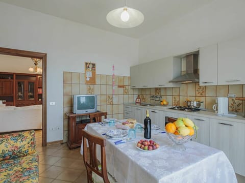 Table, Cabinetry, Property, Tableware, Chair, Lighting, Kitchen, Interior Design, Picture Frame, Countertop