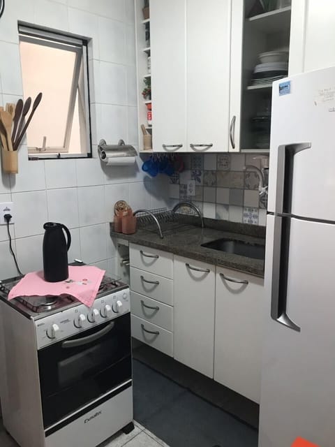 Fridge, microwave, coffee/tea maker, cookware/dishes/utensils