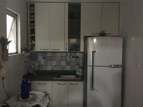 Fridge, microwave, coffee/tea maker, cookware/dishes/utensils