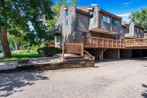 Front unit with windows on 3 sides and 2 car carport directly underneath unit.