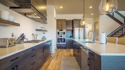 Kitchen is stocked with appliances and utensils for cooking
