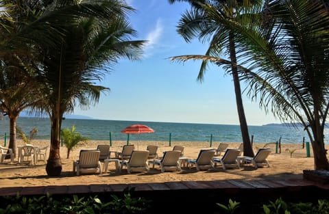 On the beach, sun loungers, beach towels