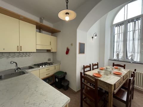 Table, Furniture, Property, Countertop, Tableware, Cabinetry, Food, Plant, Window, Chair