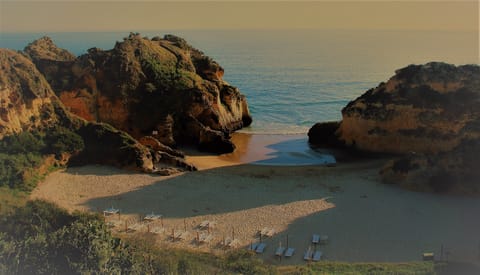 On the beach, sun loungers, beach towels