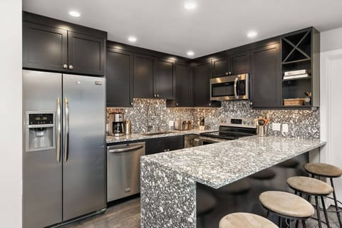 Enjoy a coffee, glass of wine or afternoon snack at the breakfast bar. The fully stocked kitchen meets all your cooking needs!