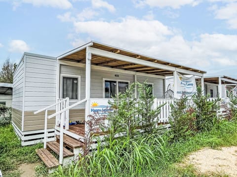 Sky, Cloud, Plant, Ecoregion, Building, Window, Land Lot, Wood, Cottage, Grass