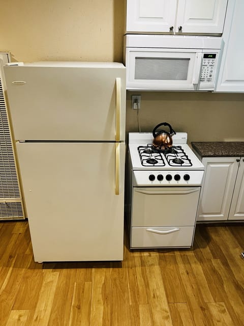 Fridge, microwave, stovetop, coffee/tea maker