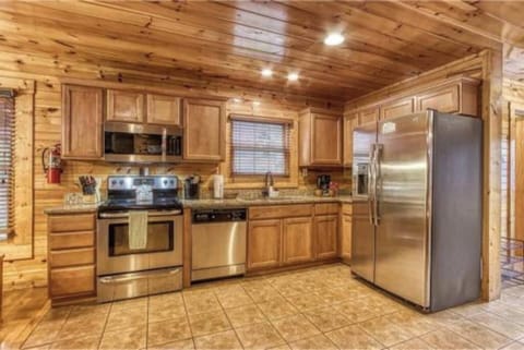 Cook and gather in the fully equipped kitchen with stainless appliances.