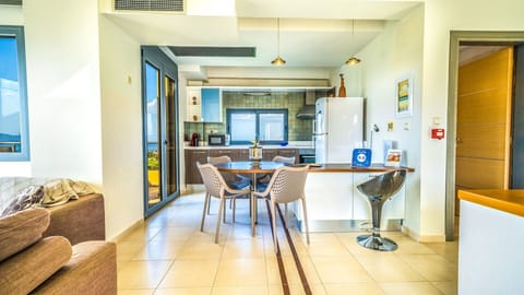 The open plan space with living room, kitchen and guests' WC.