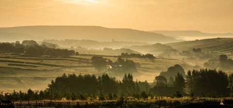 Autumn mist over the land surrounding Sutcliffe Barn looking towards Heptonstall