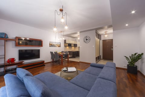  Living and dining area, highlighting the dining table with chairs and a view of the modern kitchen.