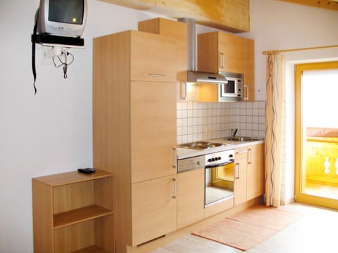 Microwave, oven, dishwasher, dining tables