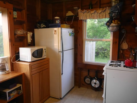 Fridge, microwave, coffee/tea maker, cookware/dishes/utensils