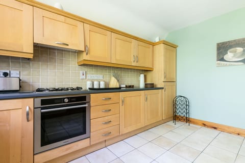 large kitchen , with all utensils for all your cooking needs.