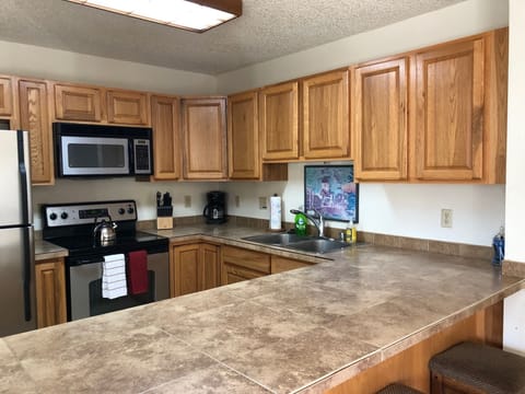 Stainless steel appliances in kitchen.