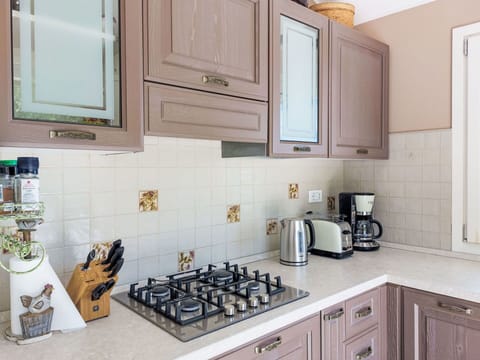 Kitchen, Countertop, Kitchen Appliance, Cabinetry, Major Appliance, Interior Design, Kitchen Stove, Stove, Sink, Gas Stove