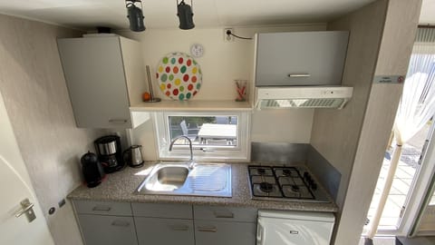 Fridge, coffee/tea maker, highchair, dining tables