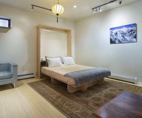 New queen-sized Murphy bed that can be accessed by moving the dining table