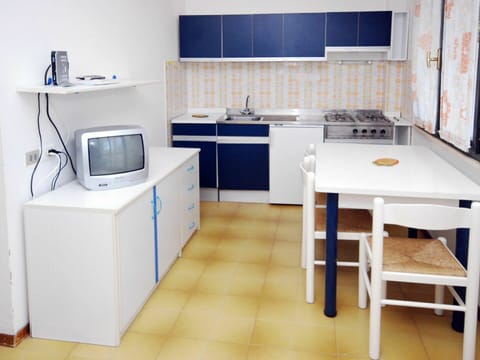 Room, Furniture, Property, Kitchen, Cabinetry, Floor, Countertop, Major Appliance, Building, Kitchen Stove