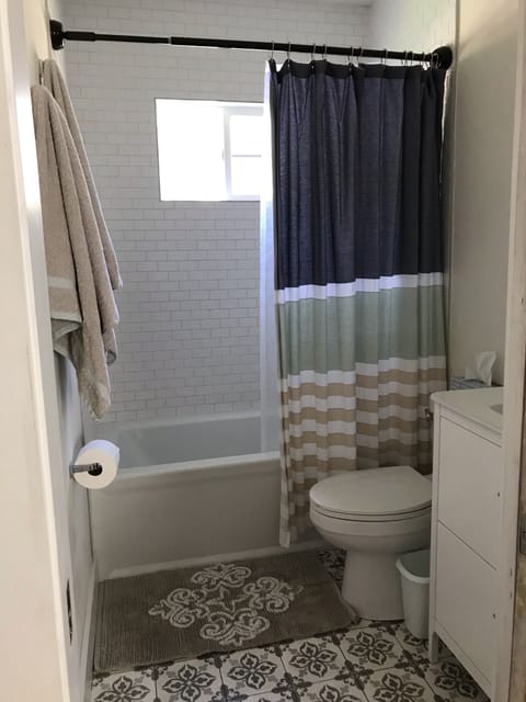 Combined shower/tub, hair dryer, towels, soap