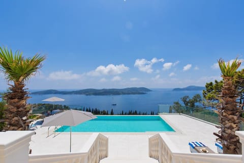 An infinity pool, a heated pool, sun loungers