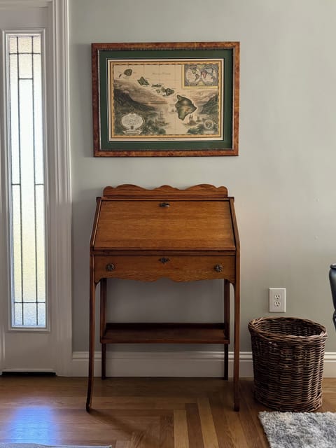 Small desk in dining area.