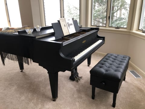 Piano in upstairs living room.
