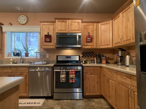 Gourmet kitchen with gas range and large convection oven.
