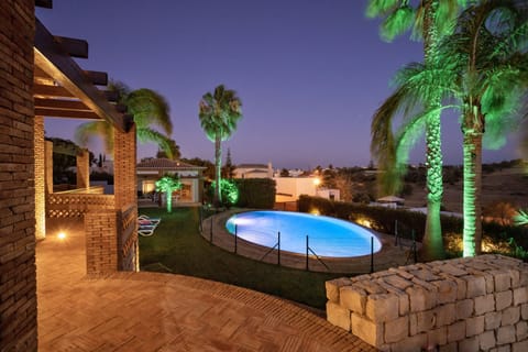 Outdoor pool, an infinity pool, sun loungers