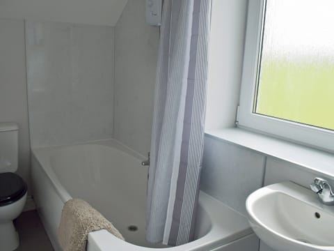 Bathroom with shower over bath | Brick Cottage No. 2 - Baltersan Farm, Baltersan, near Newton Stewart